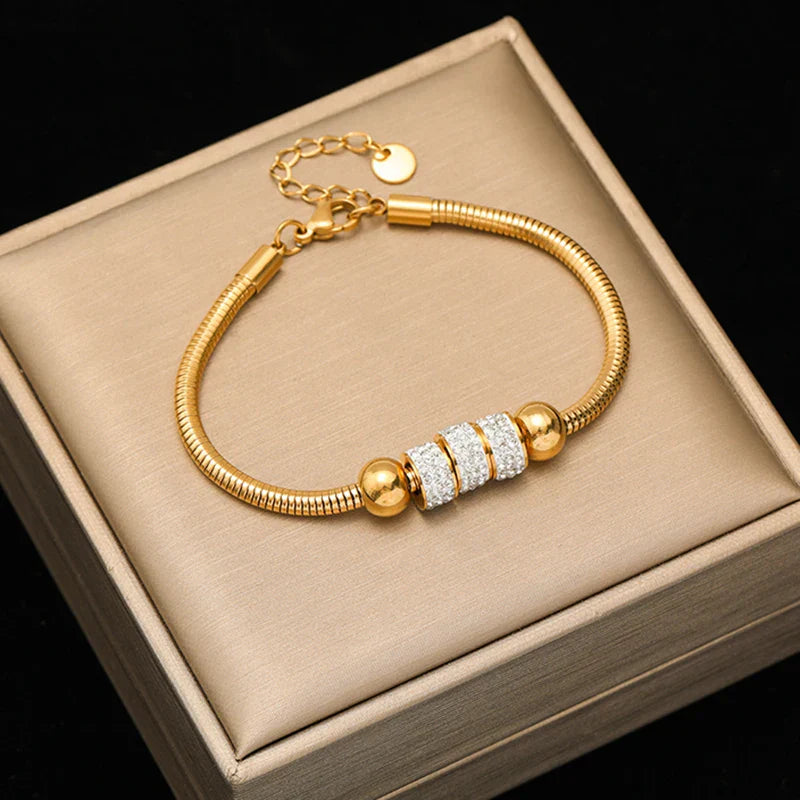 Pulseira Feminina de Aço Inoxidável Torcida Banhada a Ouro 18k