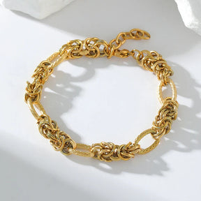 Pulseira Feminina de Aço Inoxidável Torcida Banhada a Ouro 18k