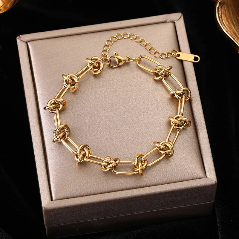 Pulseira Feminina de Aço Inoxidável Torcida Banhada a Ouro 18k